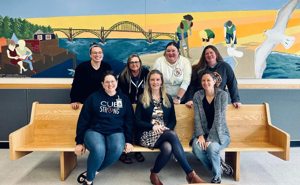 Newly certified TESOL SWEL Coaches posing together in Newport, Oregon